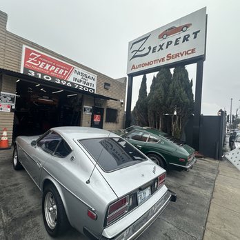 Z Expert — red Datsun at the shop