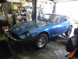 Blue Datsun in the shop